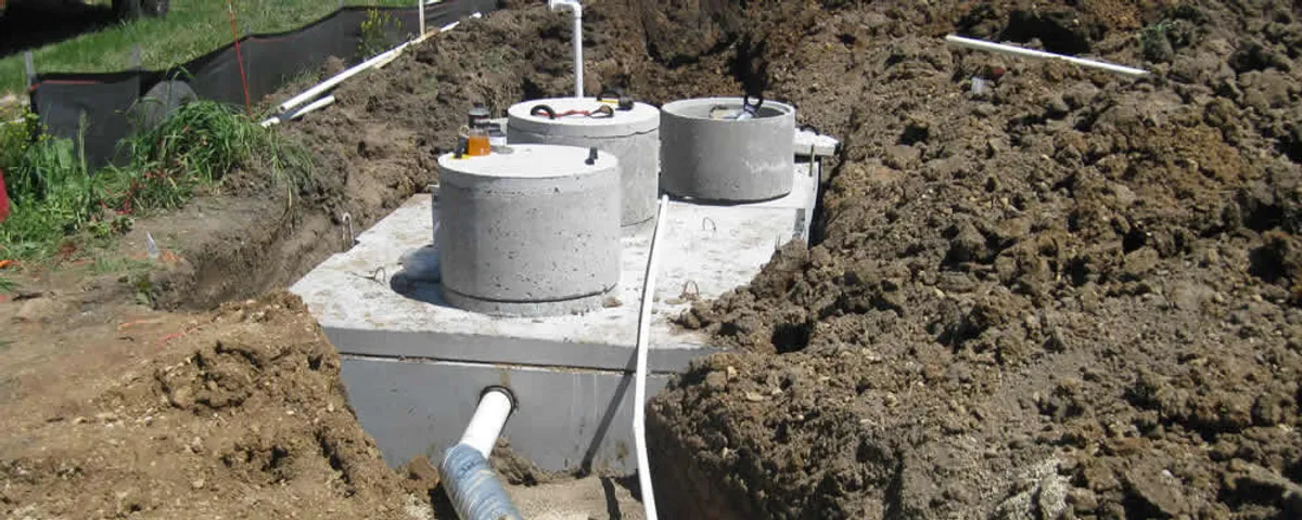 Septic system repair and installation site with tank access ports in Dallas, TX